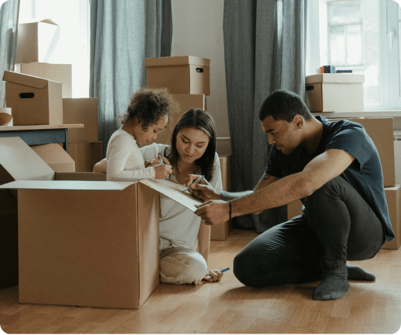 Packed and labeled moving boxes organized by room