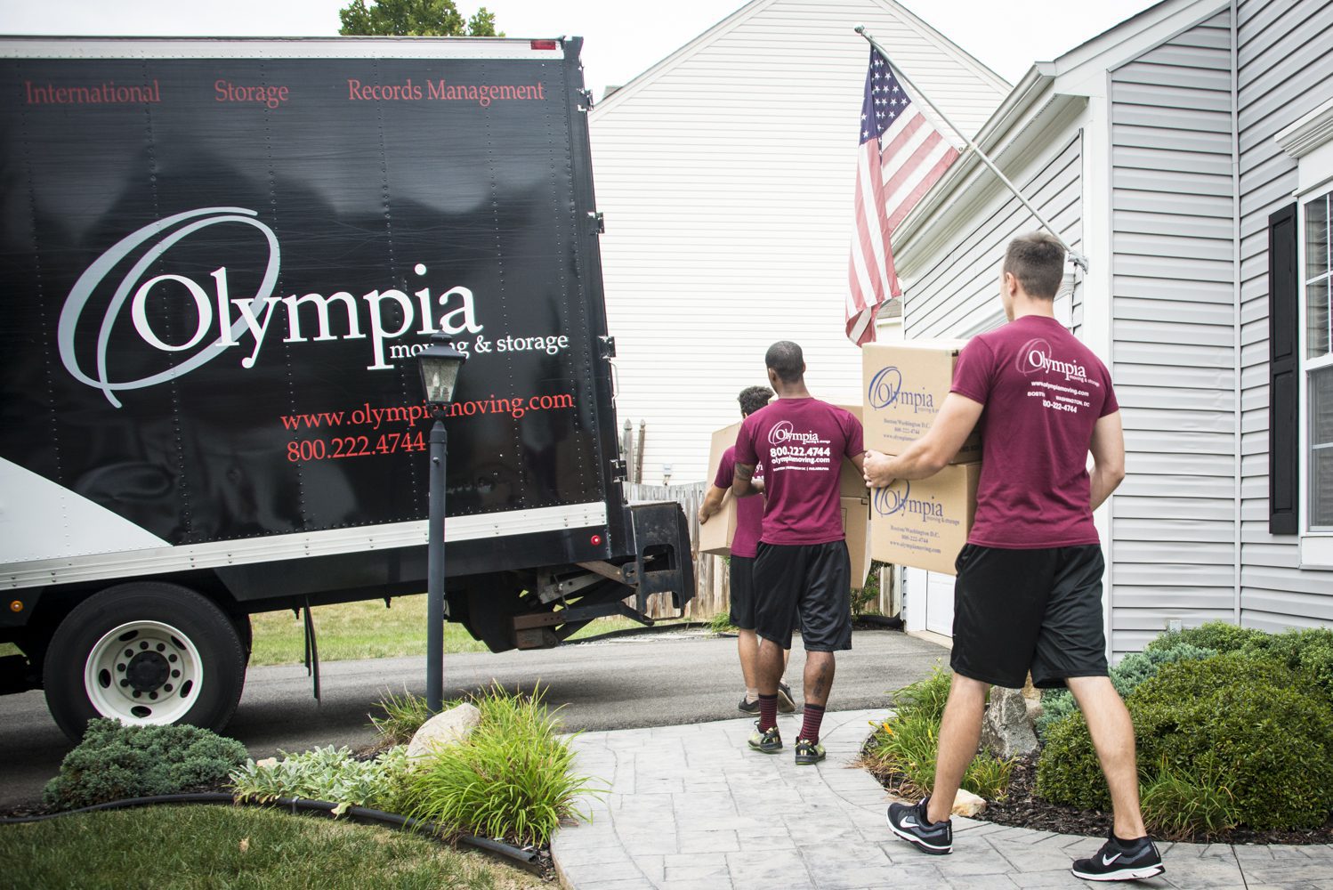 Olympia movers wrapping furniture in a client's home