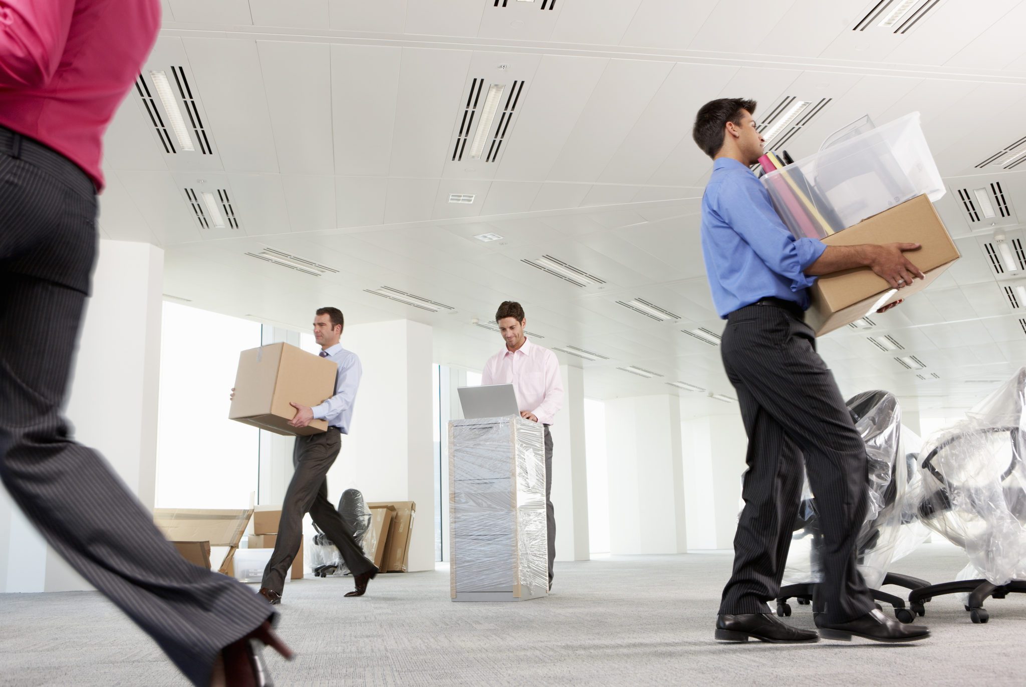 Employees packing boxes during an office move