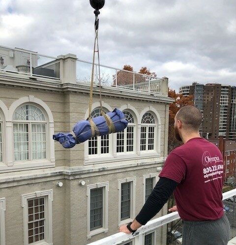 Crane hoisting an item during a specialty move