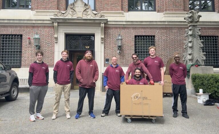 Moving bins and boxes staged in a university residence hall