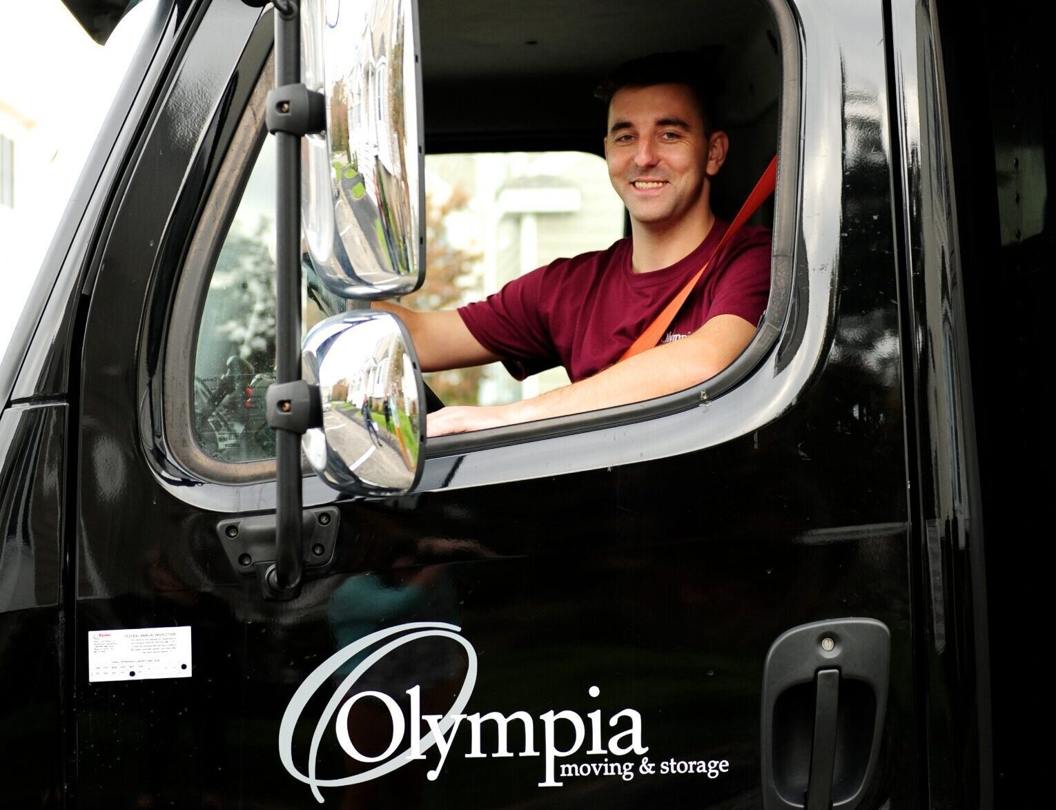Olympia mover carrying a box during an interstate move