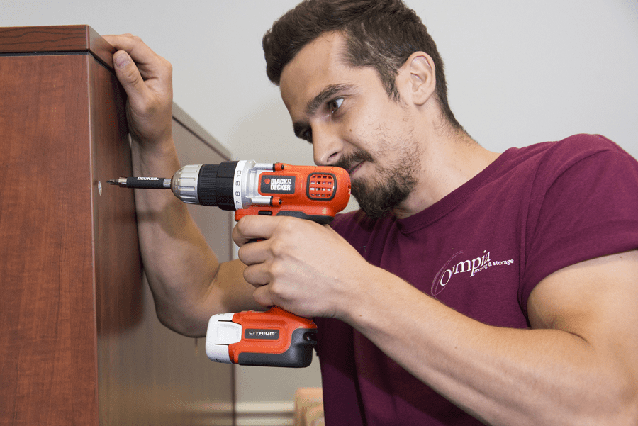 Olympia installer assembling office furniture
