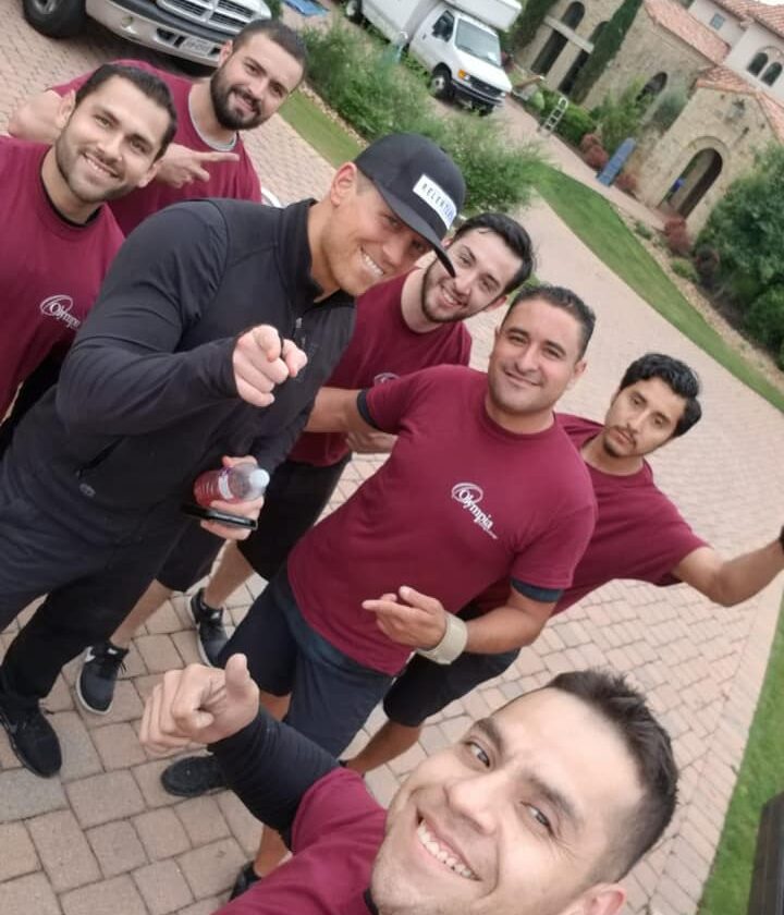 Olympia moving crew with a client after a completed move