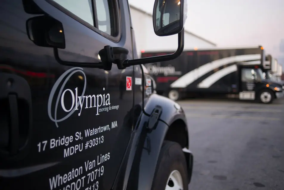 Olympia Moving & Storage team member greeting a client