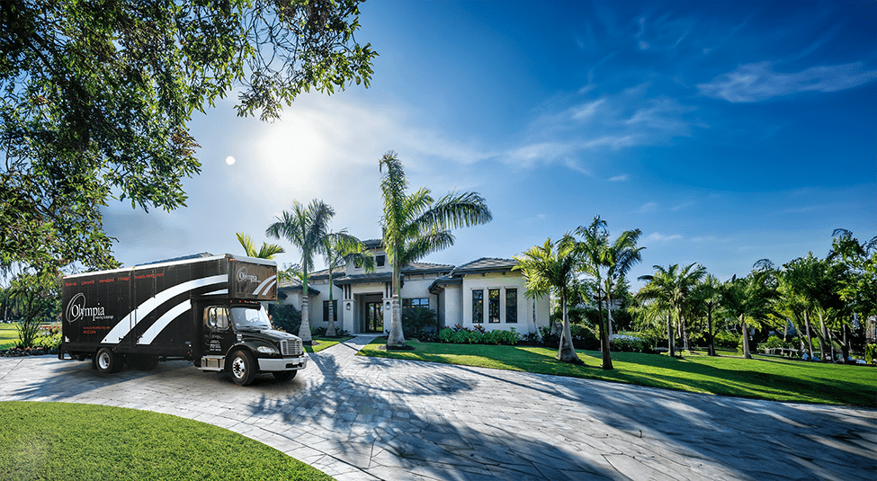 Olympia movers carrying boxes at a Tampa home