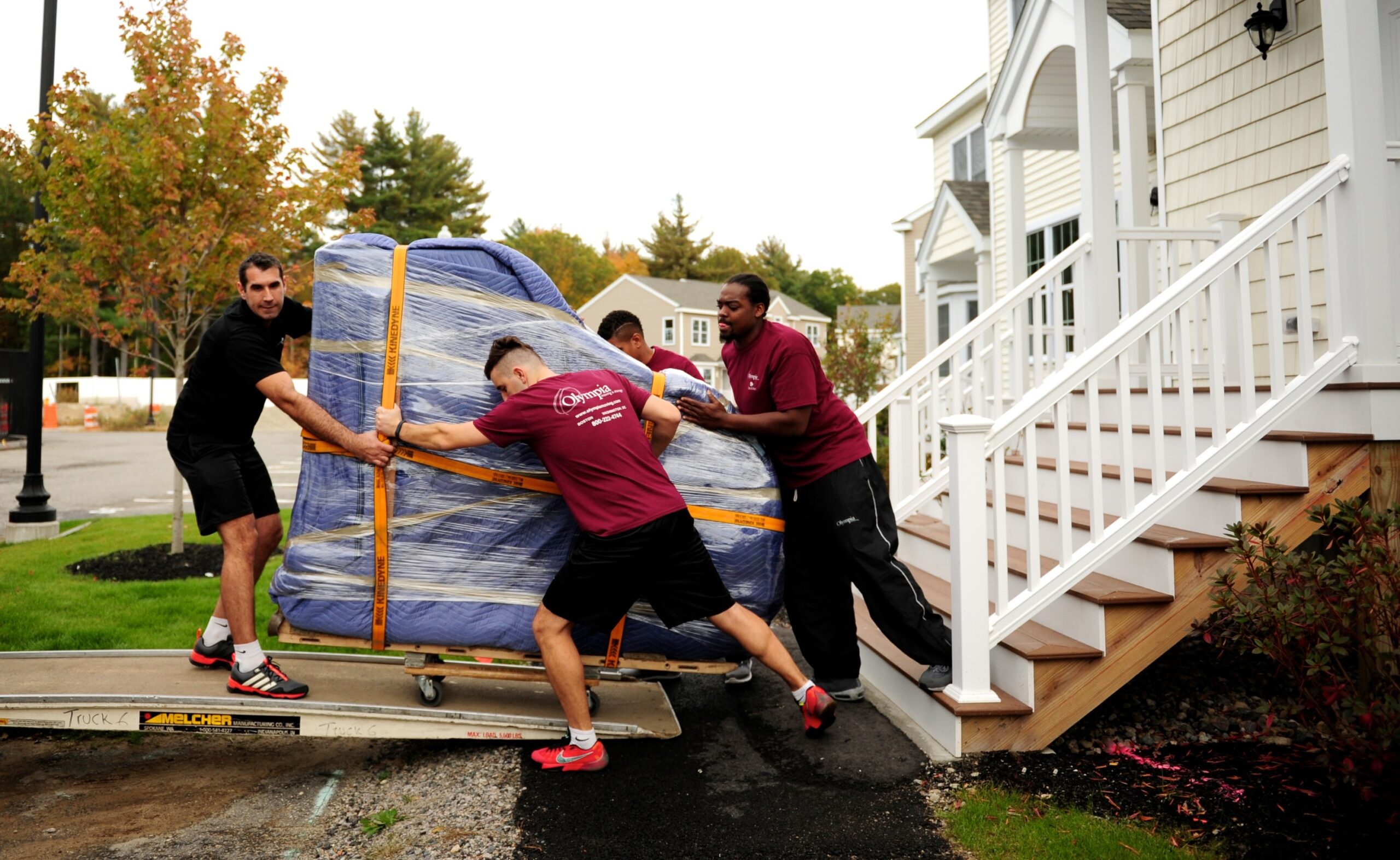 Olympia piano movers transporting a grand piano