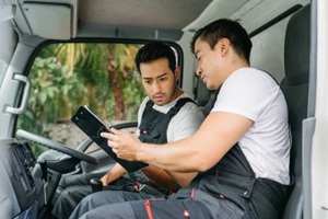 delivery professionals reviewing logistics plan for efficient transportation service